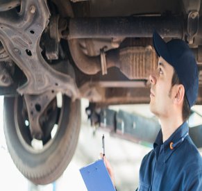 Mechanic Checking Drive Axle Boot