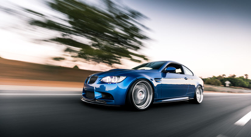 Blue BMW M3 Driving On The Road